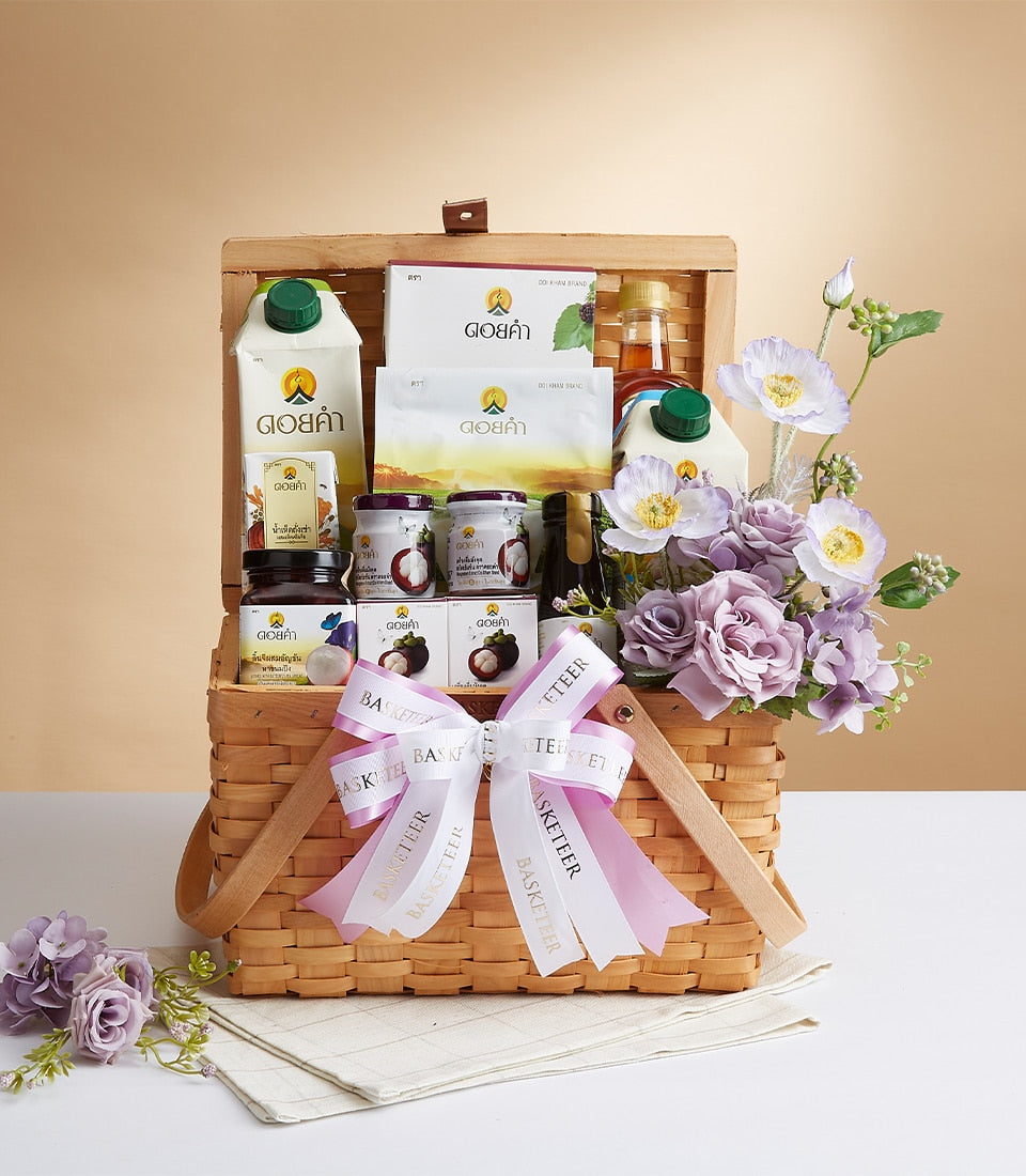 Premium woven gift basket with health and wellness products, white and pink ribbon, fresh fruit preserves, and complementary