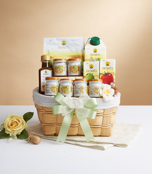 Woven wood gift basket with light green ribbon, filled with Doi Kham preserved fruits, nuts, and gourmet products