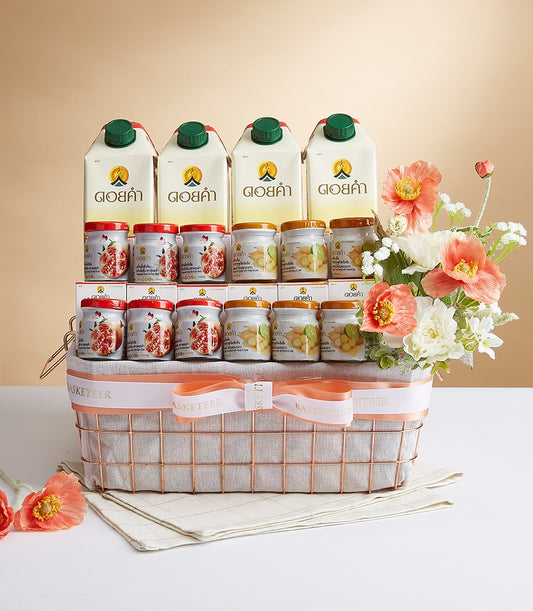 Luxury Doi Kham gift basket with premium wellness products, artisan preserves, and peach flowers in rose gold wire basket
