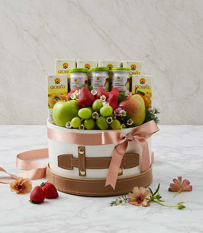 Luxury white gift box with fresh fruits, health beverages, and flowers for get well recovery