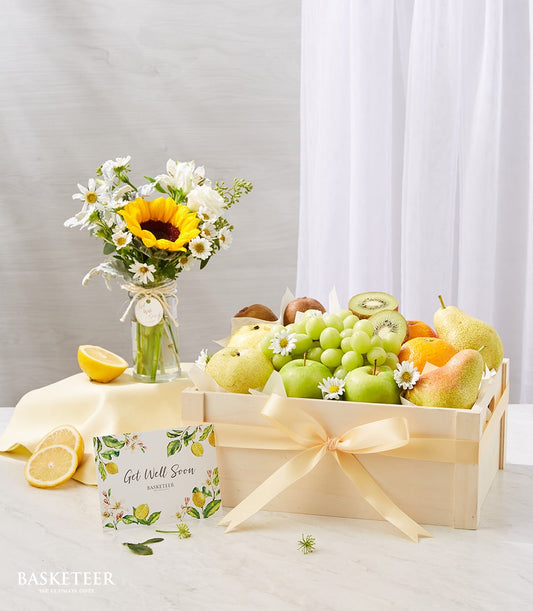 Harvest sunflower and fresh fruit get well gift set with yellow ribbon and white daisies