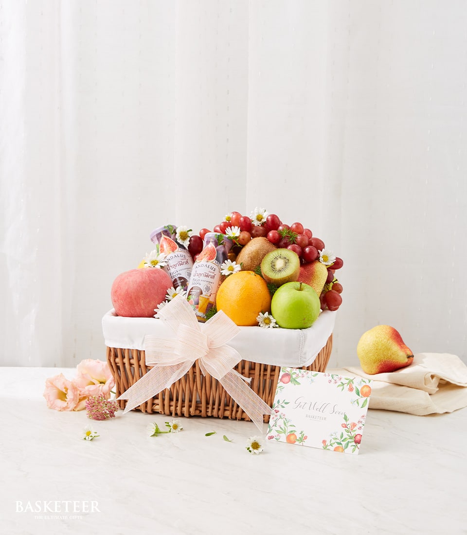 Fresh fruit and wellness gift basket with grapes, citrus, juices and flowers for get well recovery