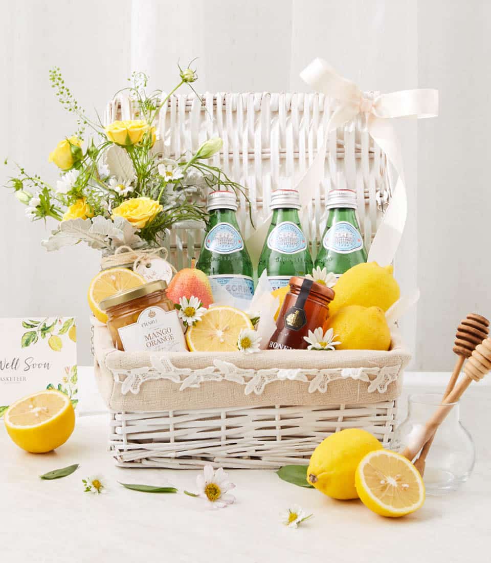 Healing Orchard Beverage Hamper with sparkling water, citrus, honey, and yellow roses for get well recovery