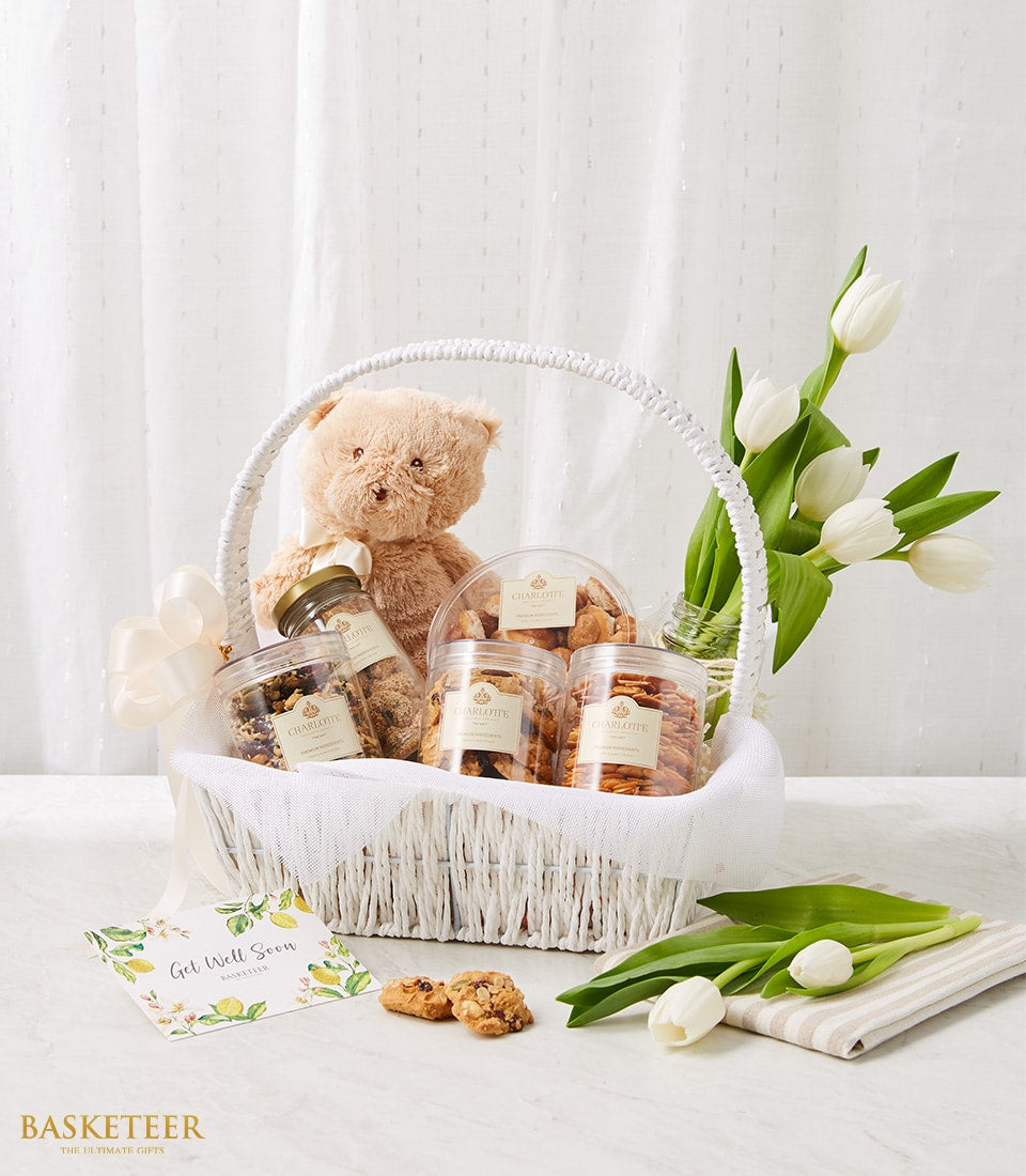 Get well gift basket with teddy bear, cookies, white tulips and artisan baked goods