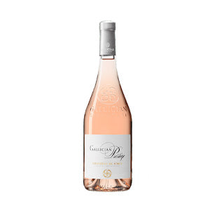 Rosé wine bottle with silver foil neck wrap and white label, classic Christmas gift hamper selection