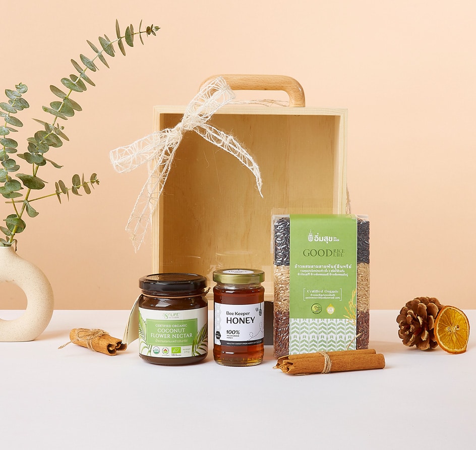 Wellness Wonders organic gift box with coconut nectar, honey, multigrain rice, and natural botanicals in light-wood