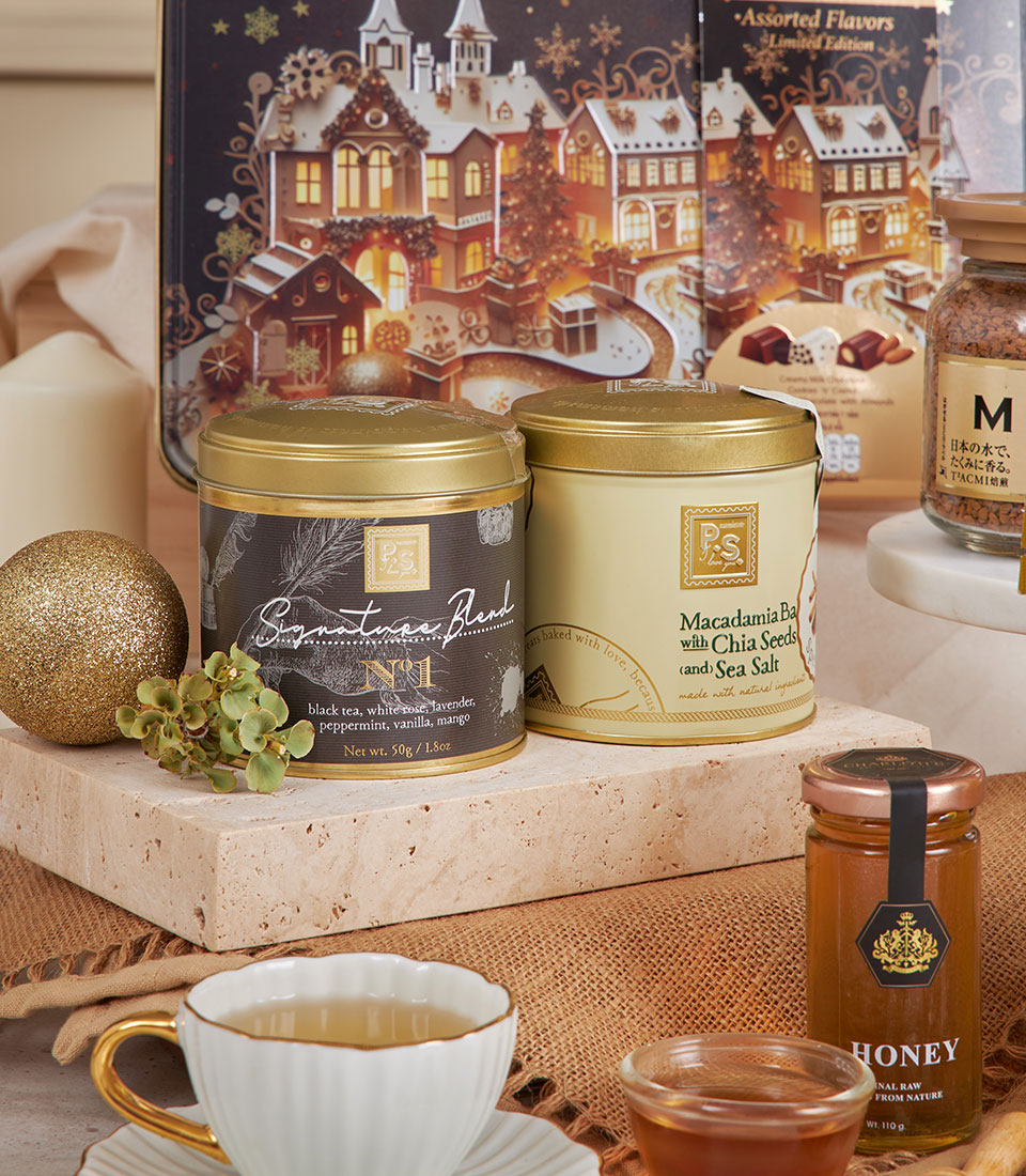 Luxury gourmet hamper with premium tea, macadamia butter, honey, chocolates, and coffee for New Year gifting