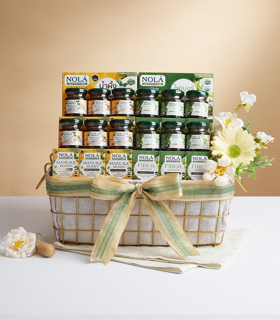 Nola's Mixed Flavor gift basket with Manuka honey, fiber supplements, and white and yellow flowers