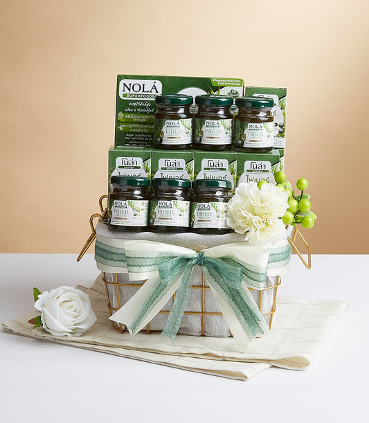 Gold wire mesh gift basket with NOLA Fiber Green superfoods jars, green boxes, and cream ribbon bow