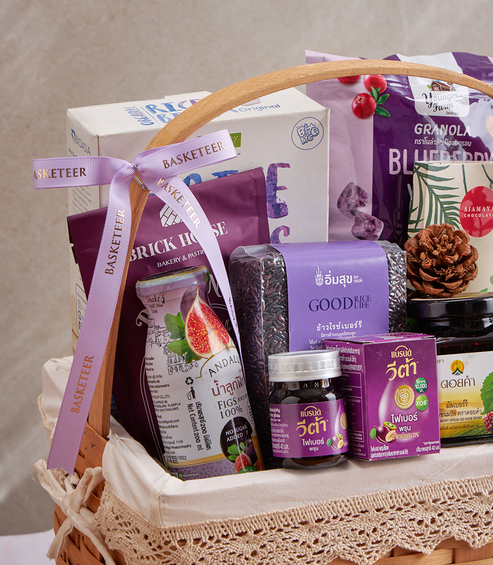 Woven blueberry and superfoods wellness gift basket with granola, rice, fiber supplements, and natural spreads