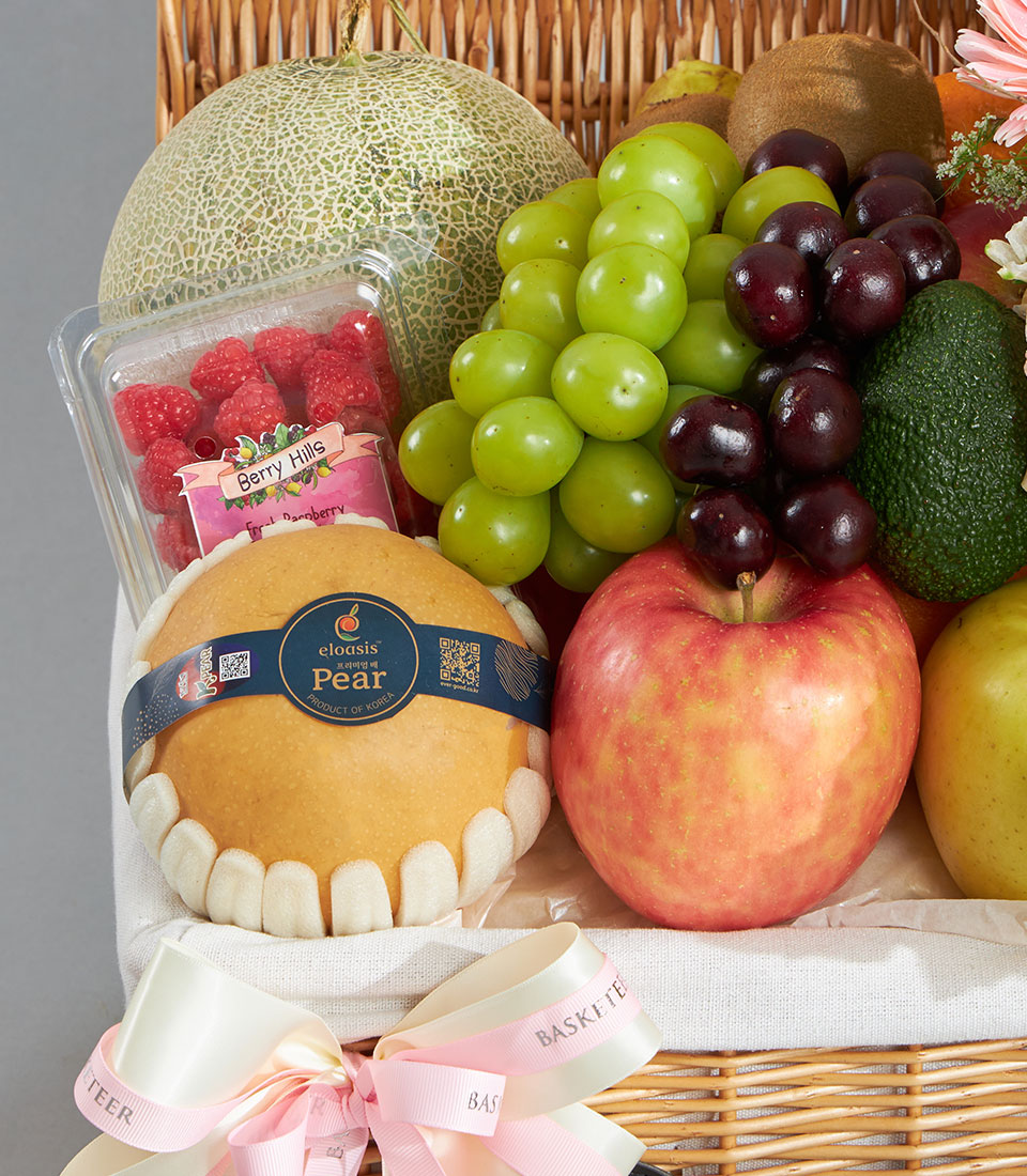 Premium fruit and flower basket with Shine Muscat grapes, cantaloupe, and fresh berries in woven wicker