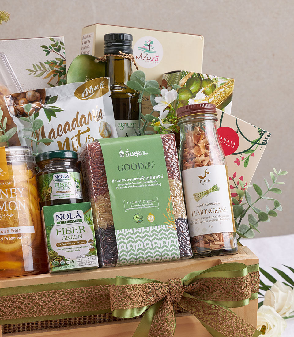Organic gourmet hamper with Pad Thai, premium olive oil, superfoods and healthy snacks in wooden gift box