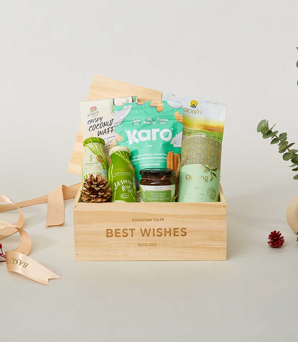 Wooden gift box filled with premium gourmet foods, jasmine rice, and artisan treats for New Year gifting