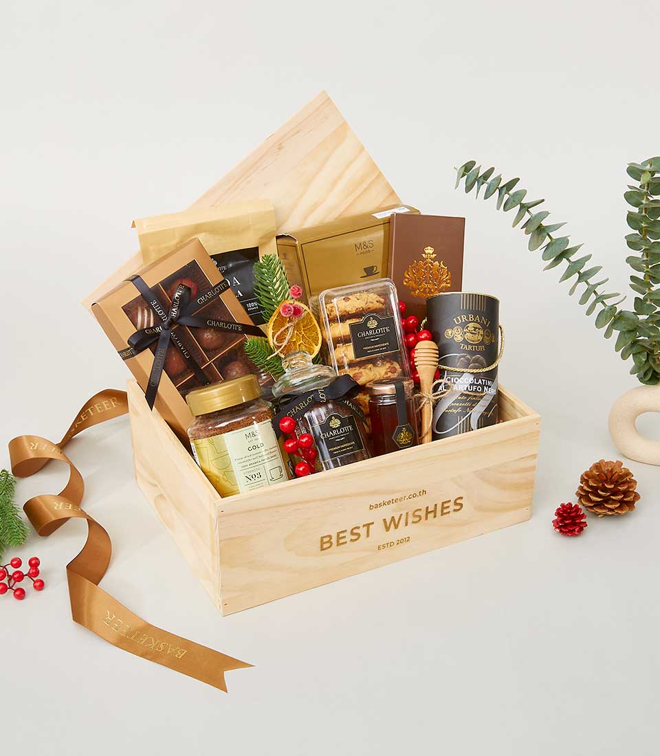Premium New Year gift hamper in wooden crate with gourmet chocolates, cookies, honey, and spices