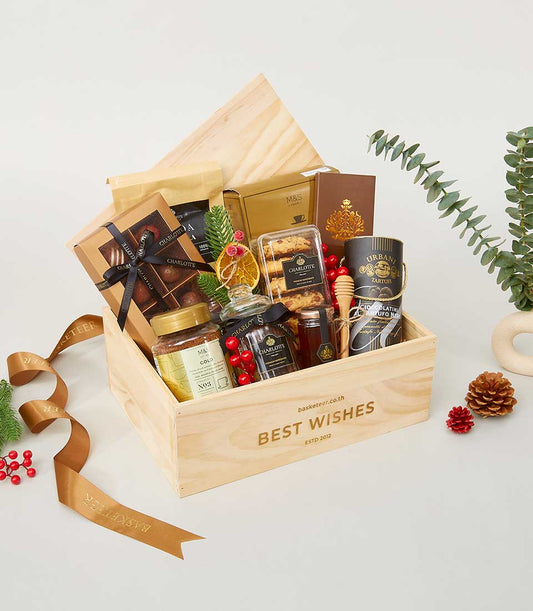 Premium New Year gift hamper in wooden crate with gourmet chocolates, cookies, honey, and spices