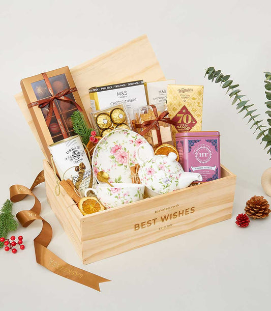 Globetrotter's Gastronomy gourmet gift box with tea set, chocolates, and gourmet treats for New Year