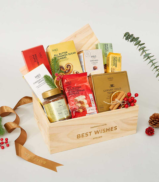 Wooden gift crate with gourmet treats, premium biscuits, coffee, and tea for New Year gifting