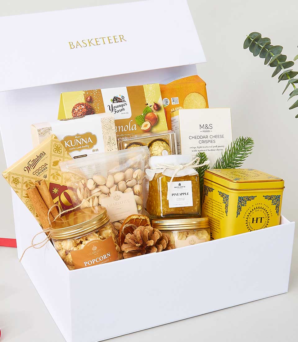 Luxury gourmet gift basket with pistachios, pineapple jam, and artisan snacks for New Year celebrations