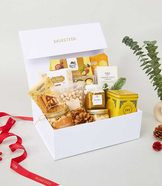 Taste of Elegance luxury gift hamper with gourmet treats, pistachios, jam, and white chocolate for New Year celebrations