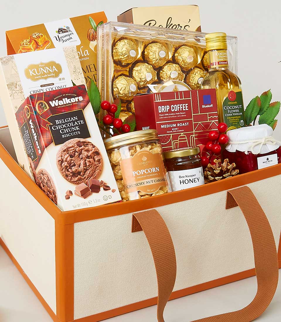 Cream fabric New Year gift hamper with gourmet chocolates, specialty coffee, honey, and artisan snacks in elegant