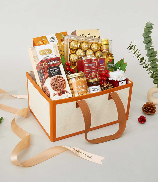 Luxury gourmet gift basket with Belgian chocolates, specialty coffee, caramel popcorn, and honey for New Year celebrations