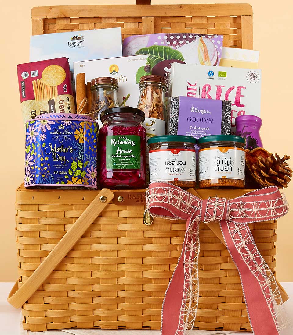 Premium wicker hamper with gourmet wellness foods, pickled vegetables, kimchi, and tea tin for New Year gifting