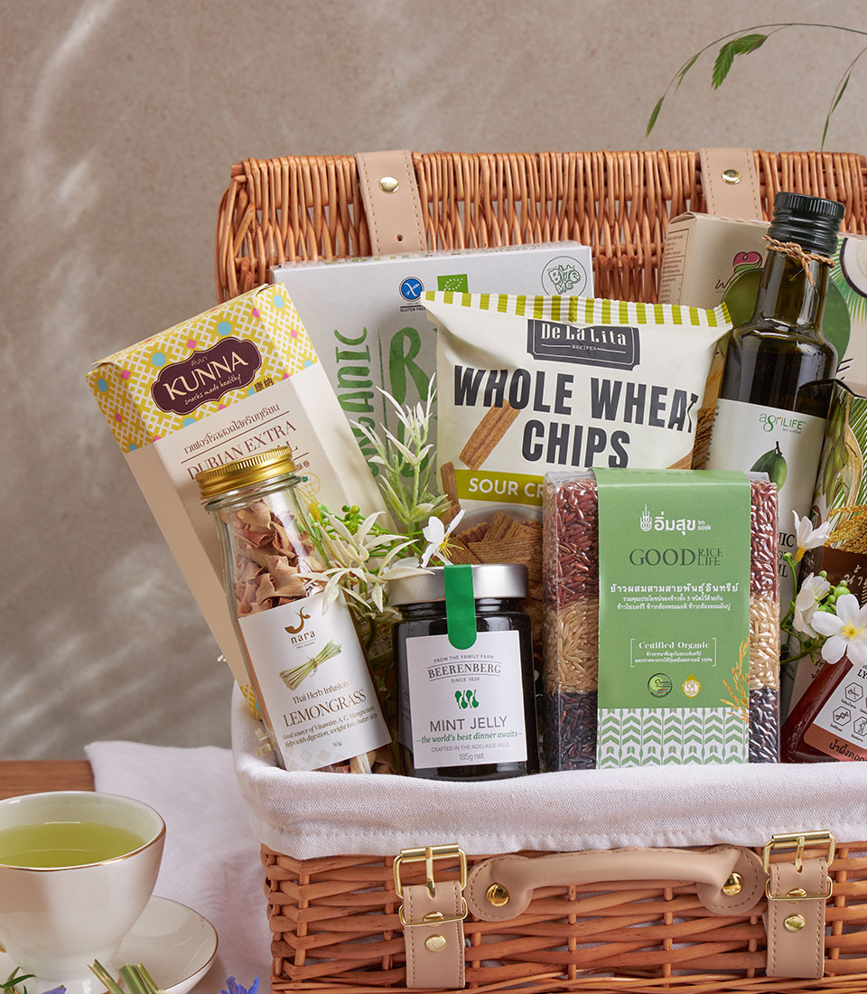 Woven wicker wellness hamper with gourmet snacks, olive oil, and organic rice for health-conscious gifting
