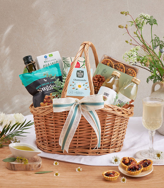 Premium olive oil, snacks and sparkling drinks gift hamper with woven basket, cream ribbon, and gourmet artisan selection