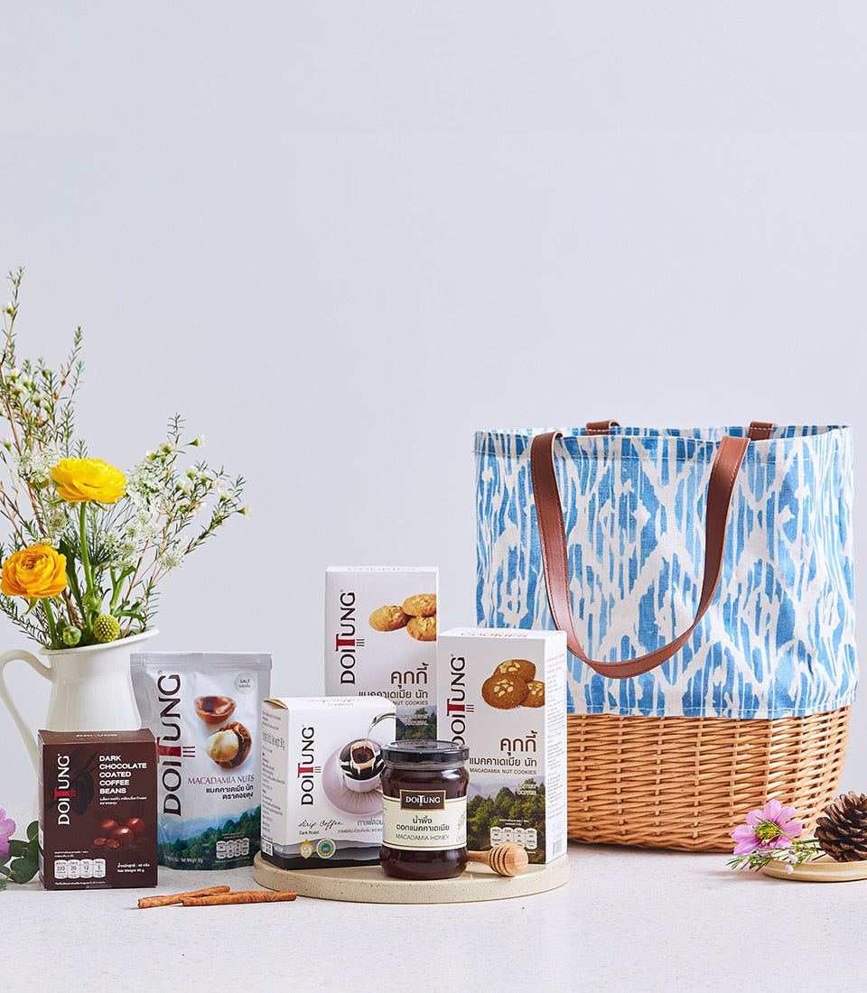 Doi Tung luxury gift collection with macadamia nuts, chocolate coffee beans, and honey in cloth bag
