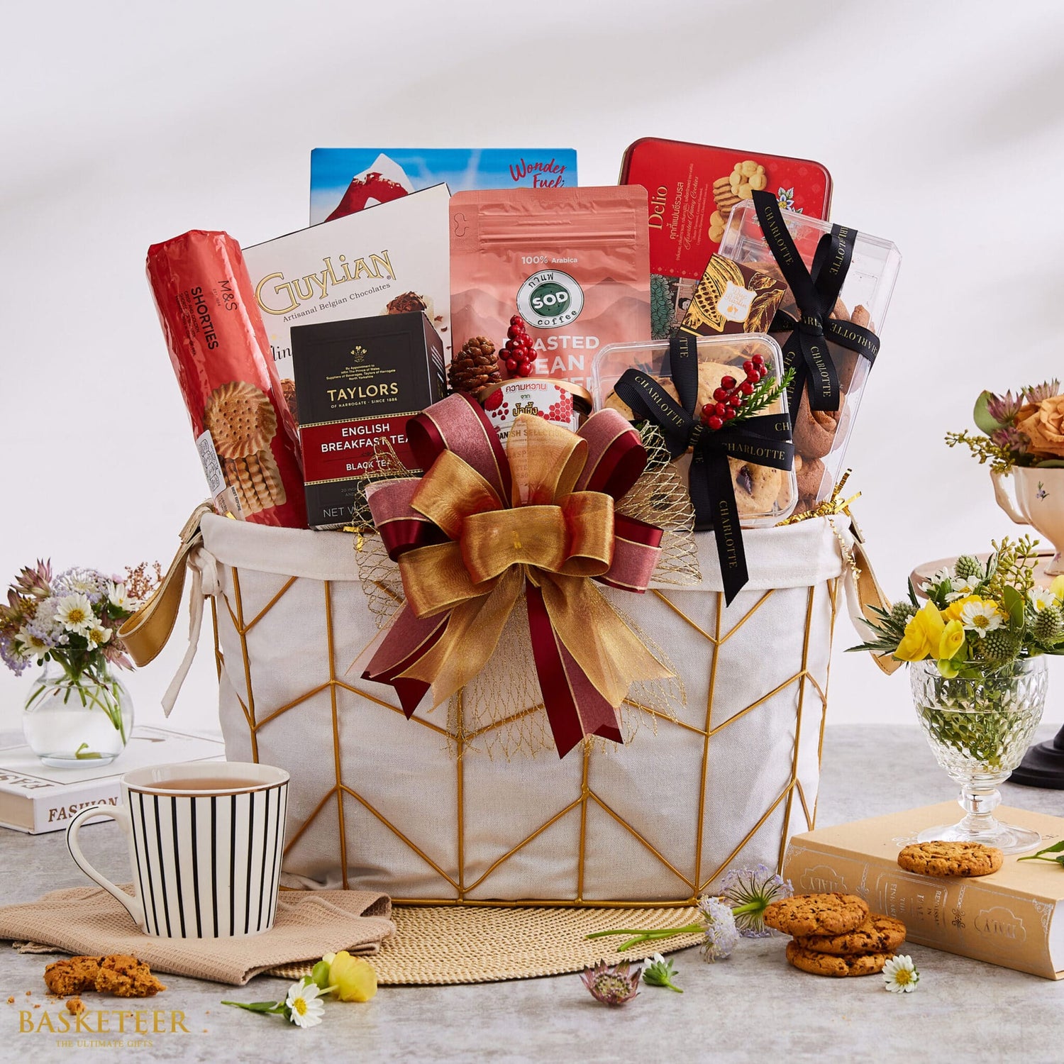 Luxury New Year gift basket with Belgian chocolates, artisan cookies, specialty tea, and premium coffee in gold-trimmed