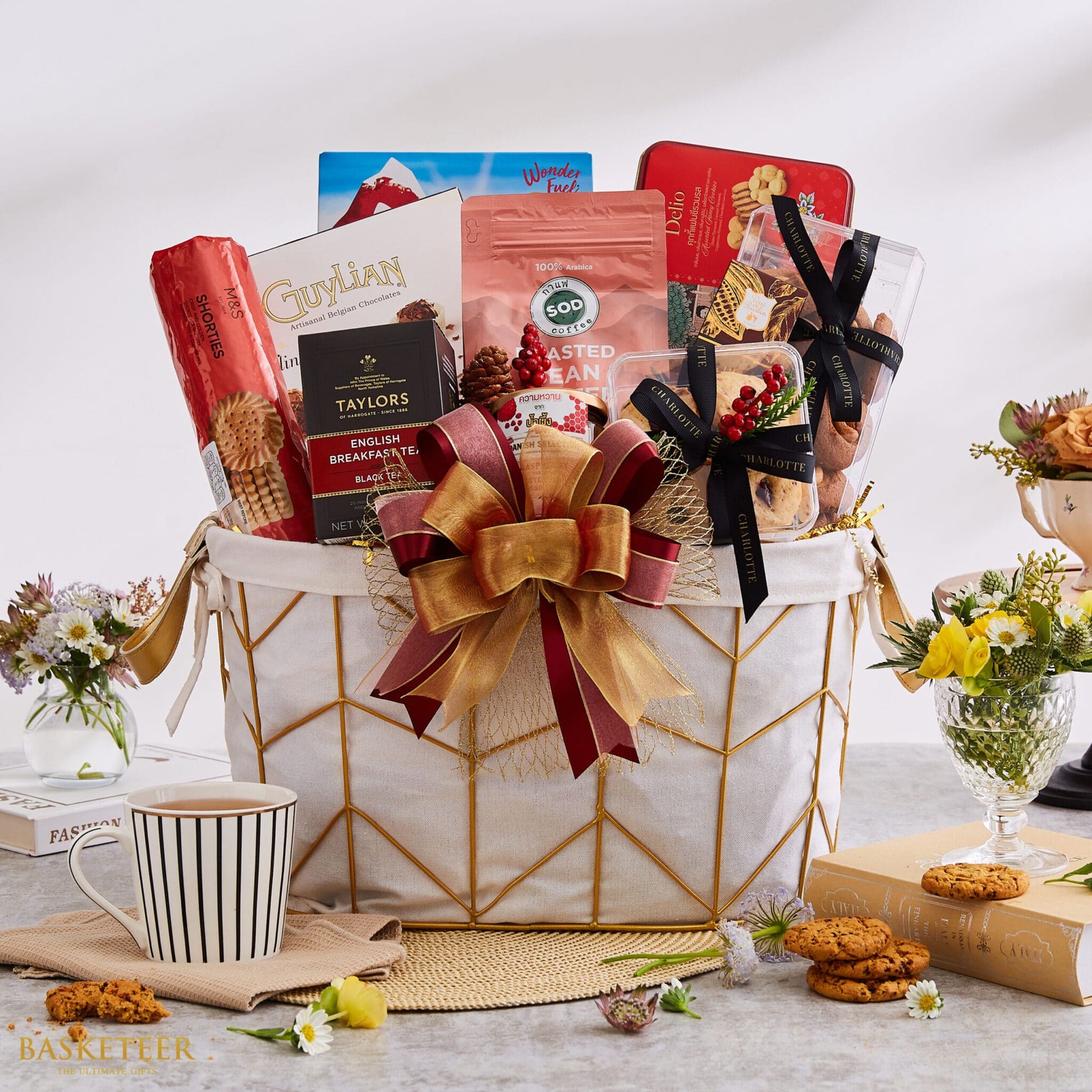 Luxury New Year gift basket with Belgian chocolates, artisan cookies, specialty tea, and premium coffee in gold-trimmed