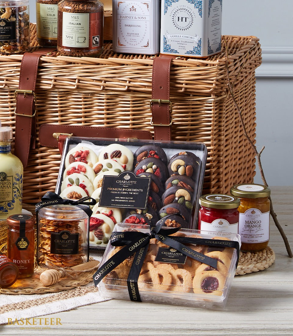 Luxury wicker hamper with gourmet coffee, Darjeeling tea, artisan chocolates, shortbread cookies, preserves, olive oil and