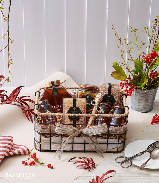 Basketeer premium hamper delivery Thailand. Woven wire gift basket with honey, honeycomb and bee pollen. Perfect corporate gift Bangkok.