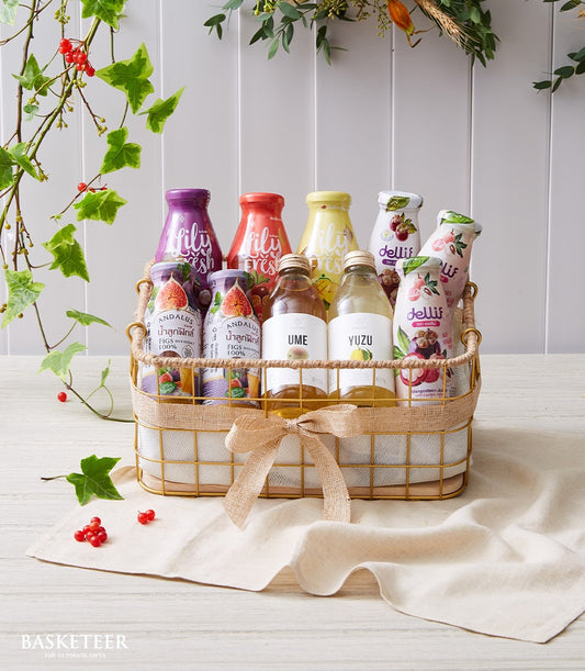Wellness Boost Sampler energizing drink gift set with colorful juices and botanicals in gold wire basket