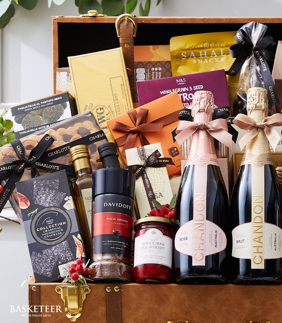 Luxury sparkling wine and gourmet chest hamper with Chandon champagne, artisan spreads, and premium treats in leather trunk