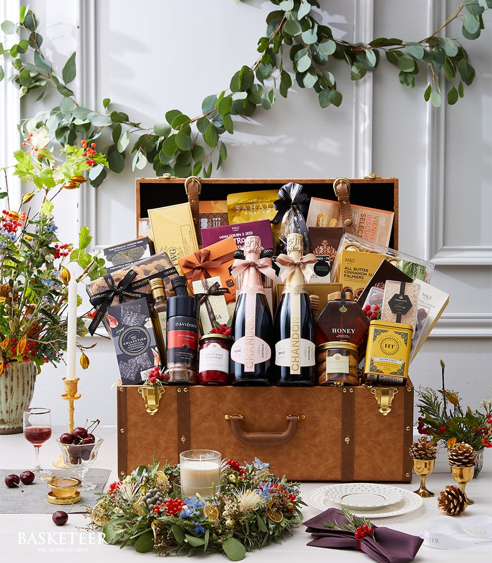 Luxury sparkling wine and gourmet gift hamper in leather trunk with Chandon, coffee, honey, and artisan treats