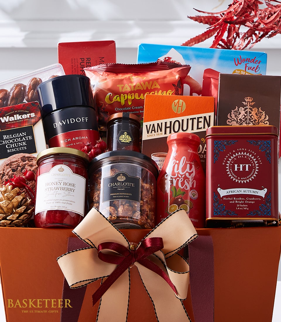 Luxurious New Year gift basket with gourmet coffee, chocolate, tea, jam, and premium treats in rich brown with gold ribbon