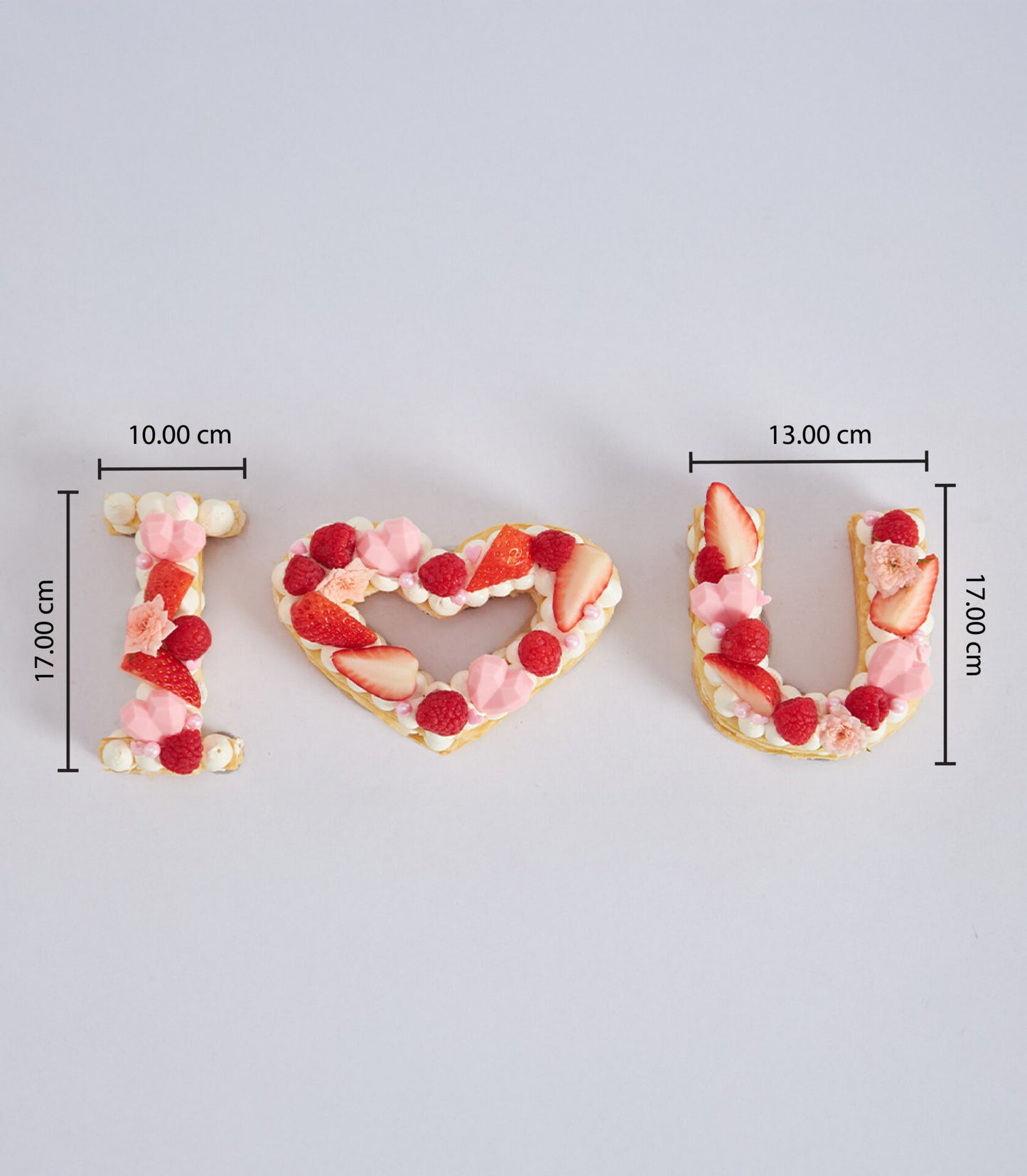 I Love You letter cake set with fresh raspberries and strawberries, artisan cream tarts for birthdays and celebrations
