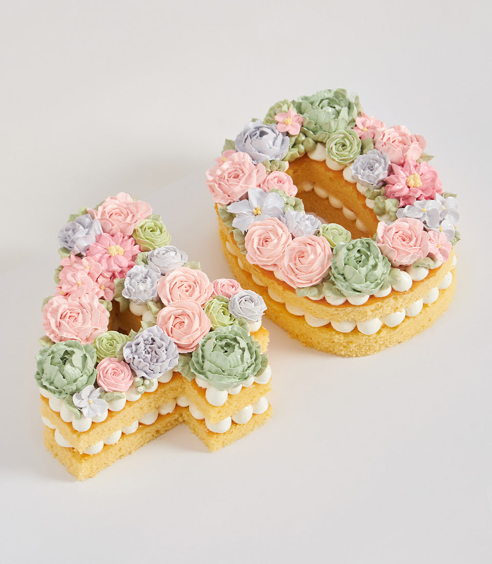 Pastel floral number 40 birthday cake with layered sponge and piped buttercream flowers