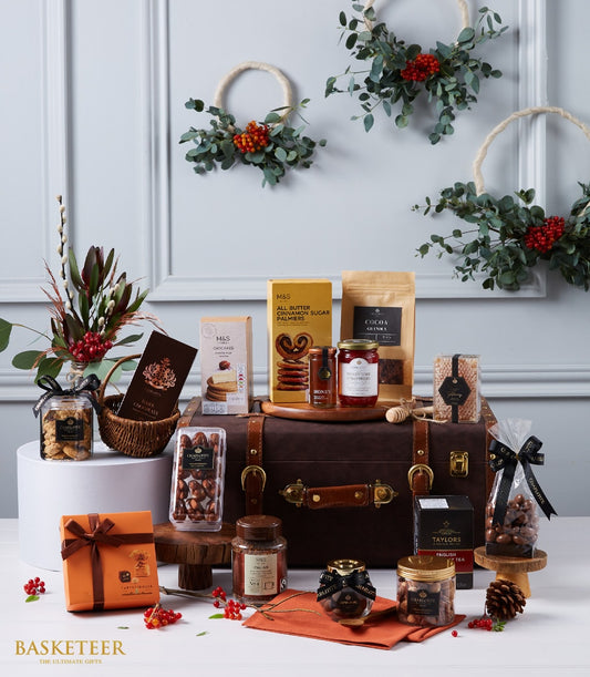 Prestigious International Goods luxury hamper with artisan chocolates, gourmet cookies, honey, jam, coffee and tea in