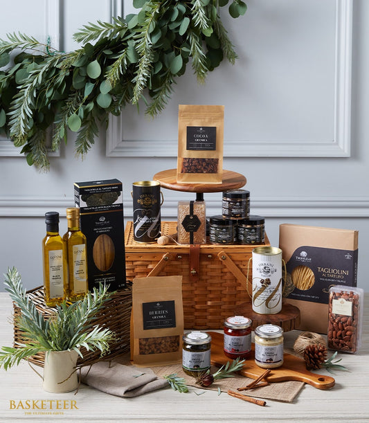 Luxury wicker picnic basket filled with gourmet truffles, olive oils, pasta, and artisan spreads