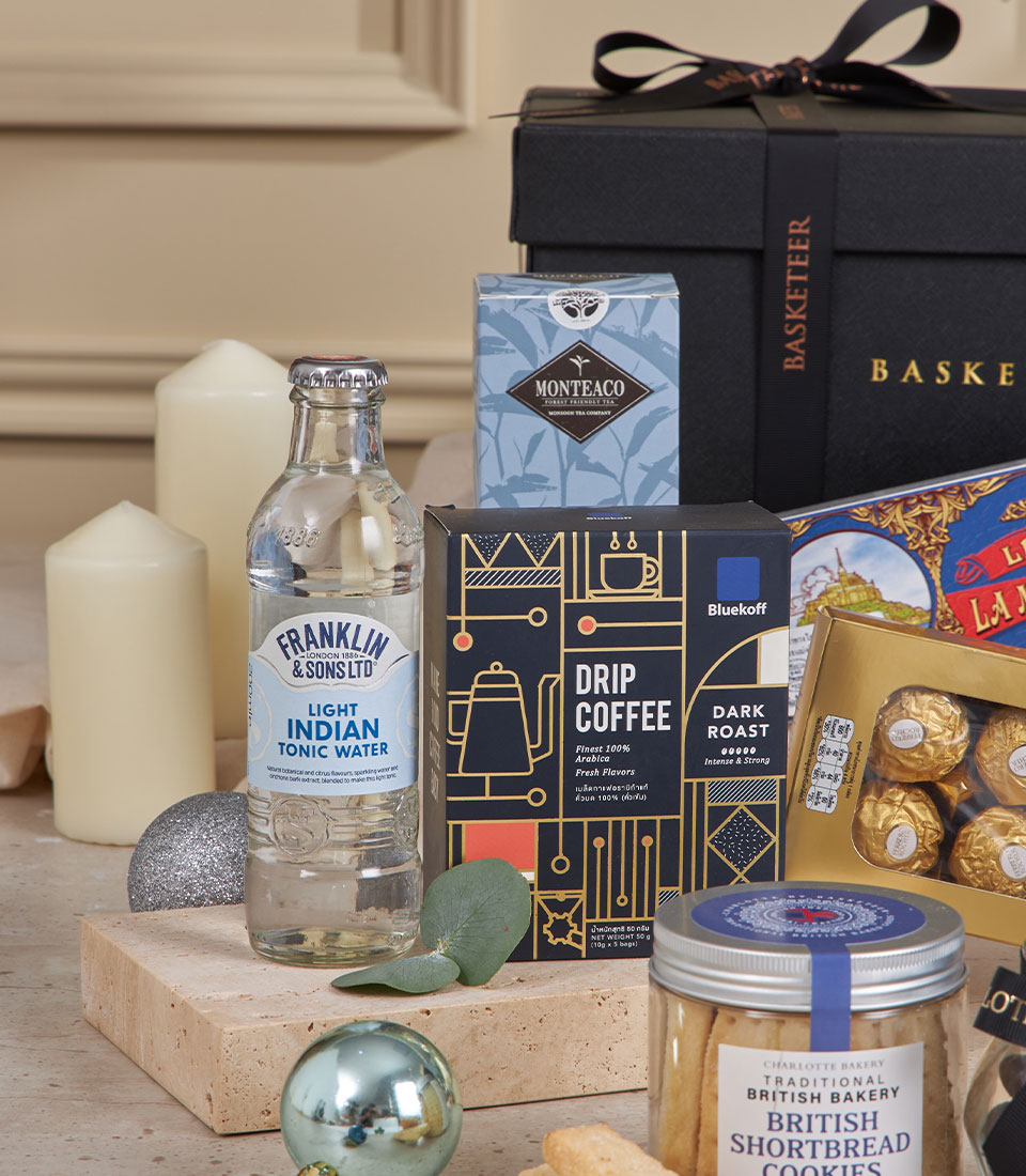 Classic blue gourmet gift hamper with premium coffee, teas, chocolates, and artisan treats for New Year celebrations