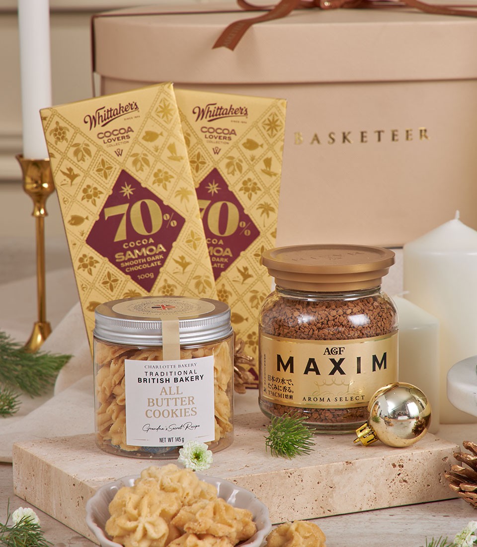 Beige luxury gift basket with dark chocolate, butter cookies, premium coffee, and festive gold accents for New Year