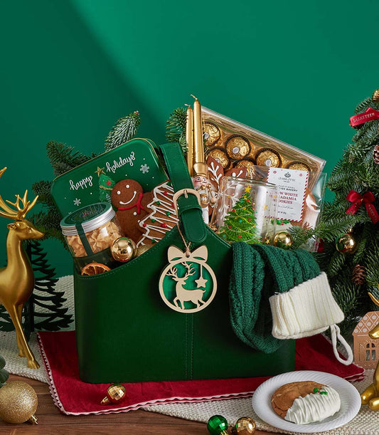 Deluxe Christmas gift basket with gourmet cookies, chocolates, and festive treats in dark green leather tote