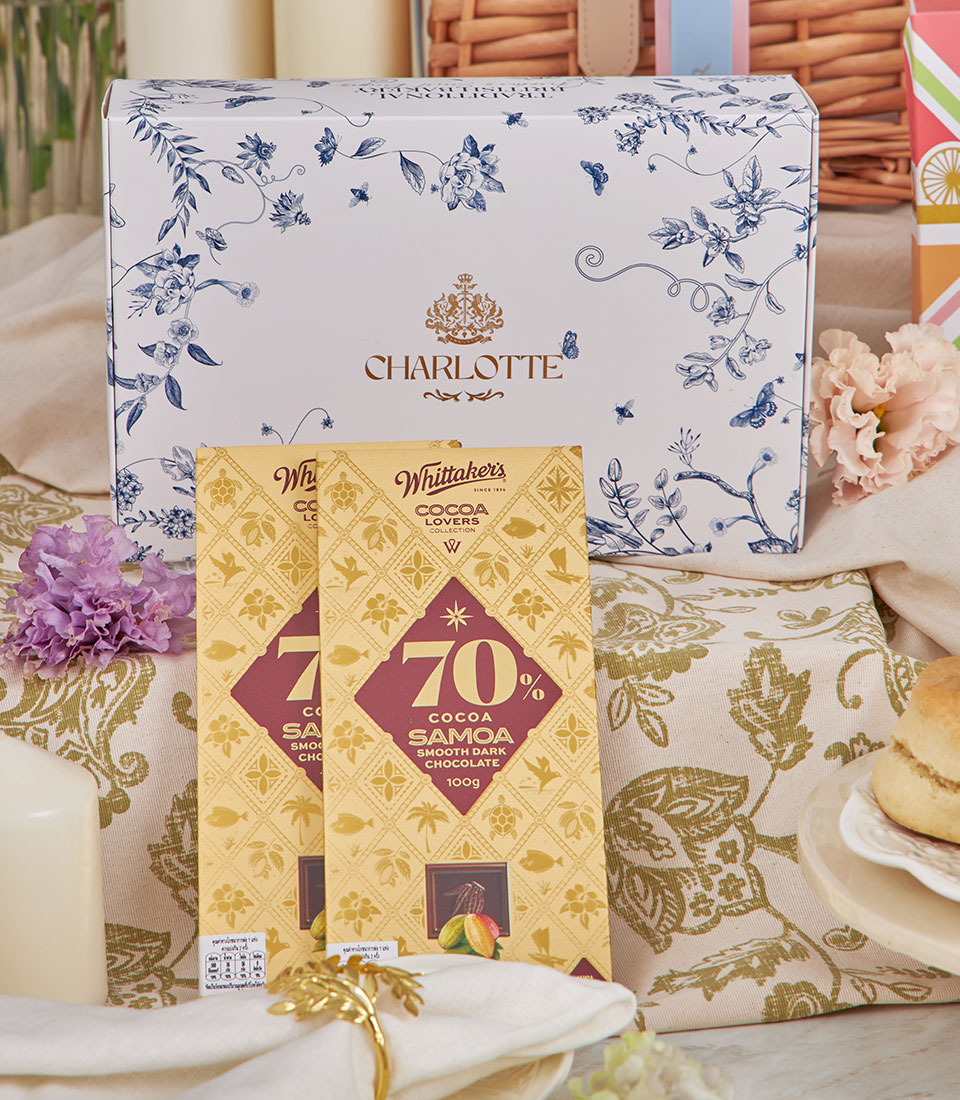 Charlotte Bakery afternoon tea gift set with dark chocolate bars and white gift box featuring blue floral design
