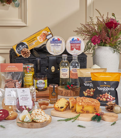 Luxury black woven gourmet hamper with Camembert, crackers, artisan cheeses, chocolate, olives, and premium beverages
