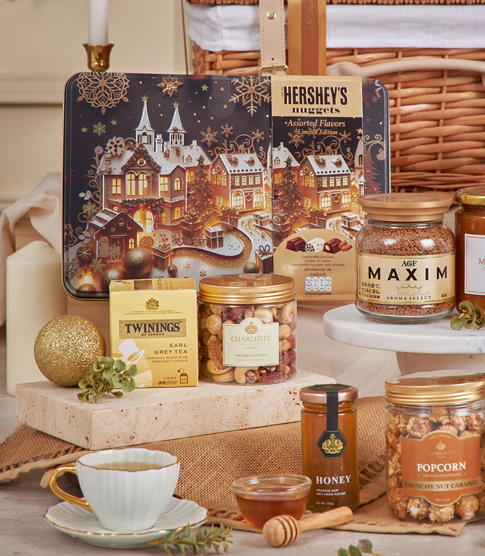 Elegant gourmet hamper with premium chocolates, specialty coffee, Earl Grey tea, honey, and caramel popcorn—luxury New Year