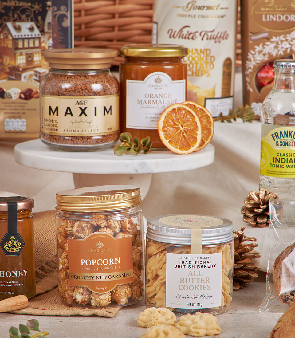 Luxury gourmet hamper with coffee, marmalade, honey, caramel popcorn and butter cookies for New Year gifting