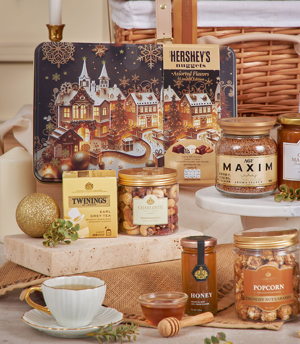 Premium golden gourmet hamper with luxury chocolates, coffee, tea, honey and festive treats for New Year gifting
