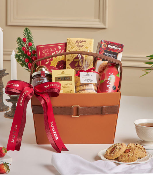Premium leather hamper with raspberry cookies, chocolate, Earl Grey tea, and gourmet treats for New Year gifting